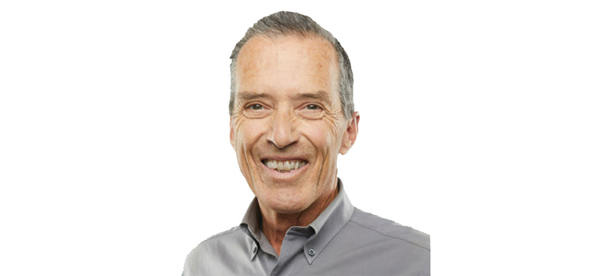 NDP candidate Kevin Van Tighem – smiling white man with short grey hair wearing a grey dress shirt