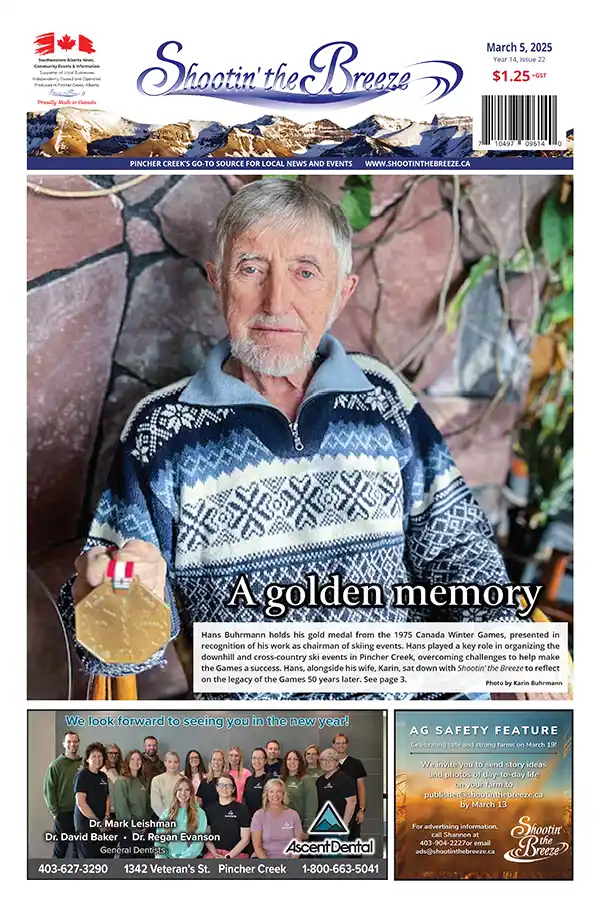 The front page of the March 5, 2025, issue of Shootin' the Breeze features Hans Buhrmann, an elderly man with a white beard holding a gold medal while wearing a blue and white patterned sweater. The headline reads, "A golden memory," and a promotion for Ascent Dental is below the photo.