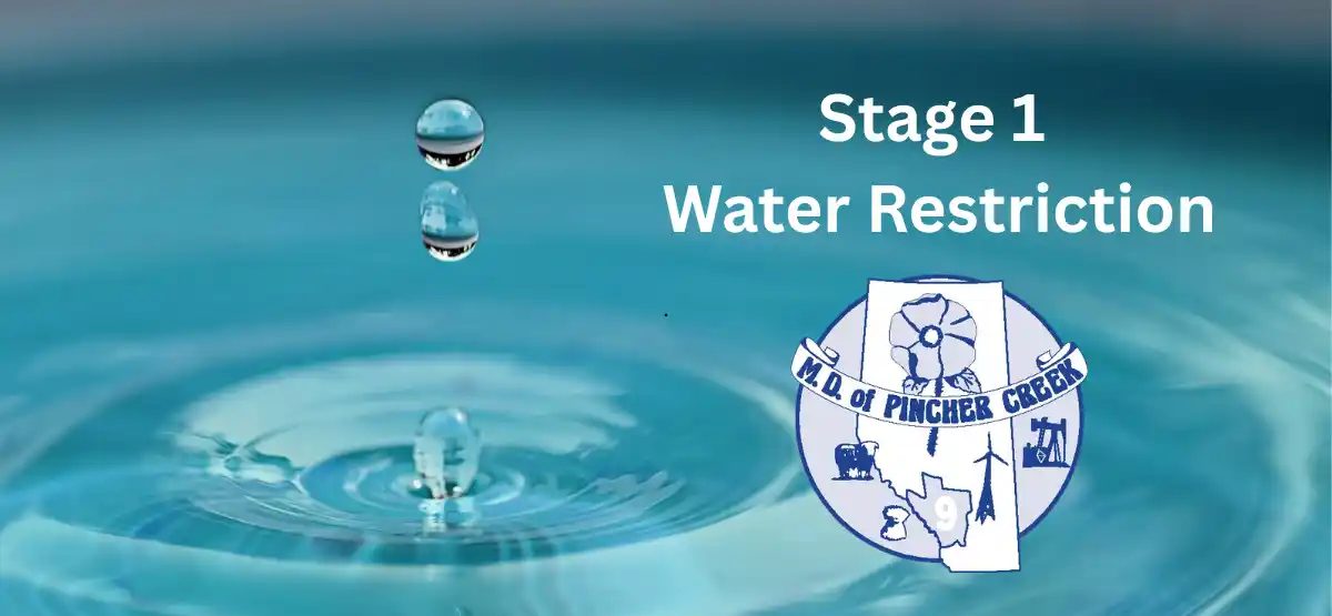 Three water droplets fall above a calm blue water surface. The text reads, "Stage 1 Water Restriction," next to the M.D. of Pincher Creek logo.