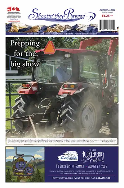 Facilities manager prepares outdoor arena with tractor and groomer for Pincher Creek Pro Rodeo weekend