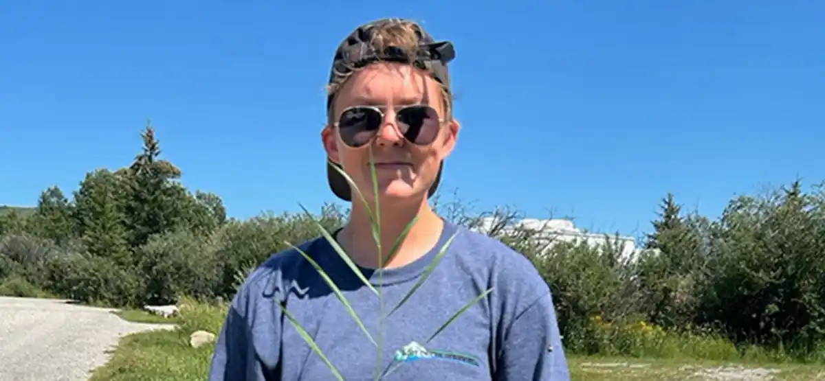 Kaitlynn Hunter wearing camo headband and dark sunglasses outdoors