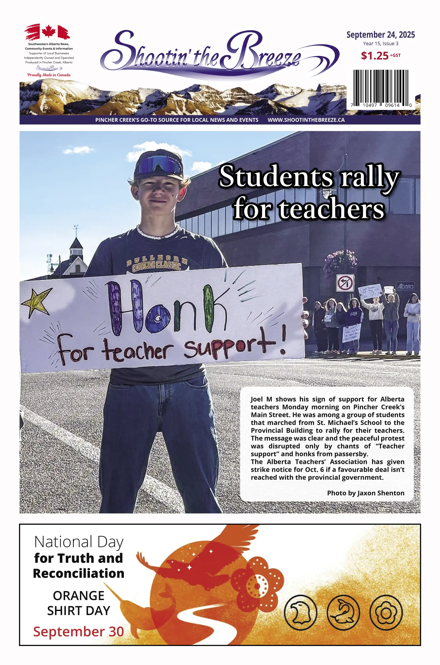 Student holding homemade sign supporting Alberta teachers during march to Provincial Building
